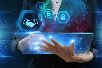 The concept of business, technology, the Internet and the network. A young entrepreneur working on...