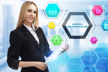 The concept of business, technology, the Internet and the network. A young entrepreneur working on a virtual screen of the future and sees the inscription: Business transformation