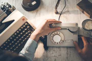 man hand phone with typewriter - Powered by Adobe