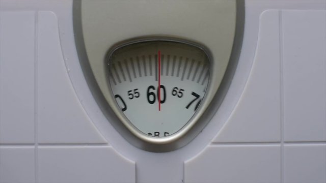 Close up body weight scales for measure weight loss.Weighing scale to healthy slimming concept.