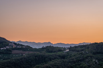 Sunrise over Brda vineyard hills and mountain Triglav in Slovenia