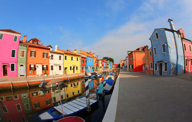 Painted Houses Burano Island near Venice in Italy with blue sky - obrazy, fototapety, plakaty