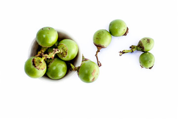 Popular Indian pickle fruit isolated on white i.e. Fragrant manjack or snotty gobbles, glue berry,...