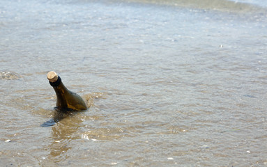 Fototapeta premium one bottle of glass on the sea