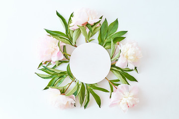 Mockup round white frame with light pink peonies on a white background