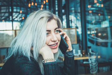 Beautiful young girl talking on a cell phone.