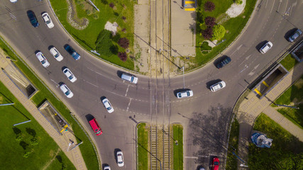 Overhead drone shot of beautiful park and busy roundabout © Quatrox Production