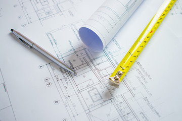 Bangkok, Thailand 28 June 2019: Architect desk with pen, meter cartridge on the blueprint for the house.