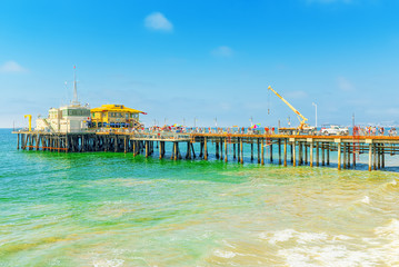 Famous Pier in Santa Monica with tourists, a suburb of Los Angeles.