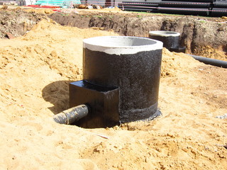 installation of wells from reinforced concrete rings and eyeliner pipes