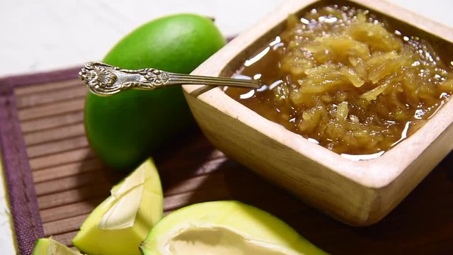 Mango Chunda or Sakhar Amba is a traditional indian summer recipe made using accha aam preserved in sugar syrup for days. selective focus