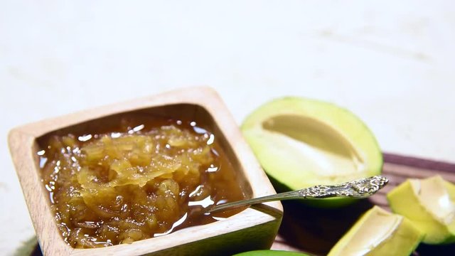 Mango Chunda or Sakhar Amba is a traditional indian summer recipe made using accha aam preserved in sugar syrup for days. selective focus