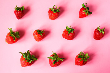 Strawberry on pink background. Strawberry pattern.