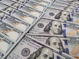 A pile of one hundred US dollars - Banknotes. Cash of hundred dollar bills , dollar background with high resolution