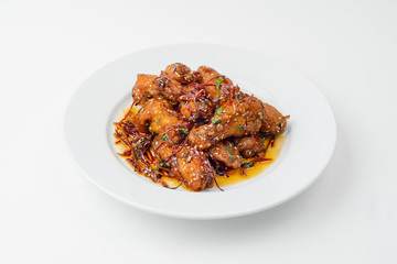 fried chicken with vegetables on white plate