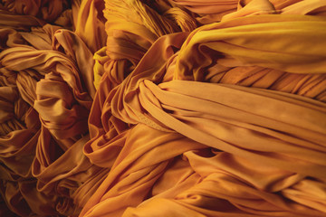 Closeup of lines in yellow fabric