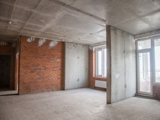 Concrete and brick walls in the apartment for repair