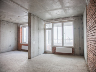 Fototapeta premium Concrete and brick walls in the apartment for repair
