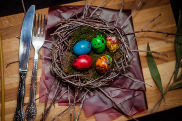 colorful Easter eggs quail in the nest