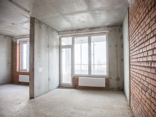 Concrete and brick walls in the apartment for repair