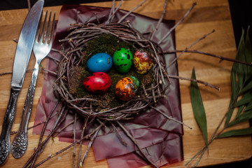 colorful Easter eggs quail in the nest