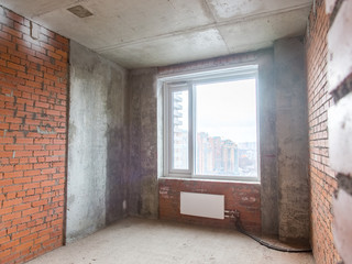 Concrete and brick walls in the apartment for repair