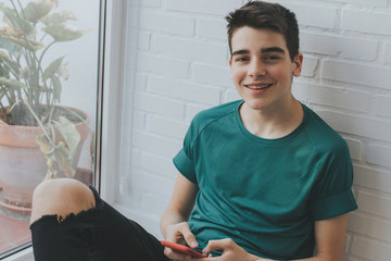 young or teen with mobile phone