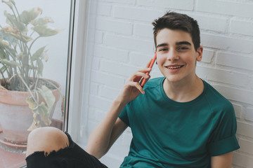 young or teen with mobile phone