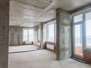 Concrete and brick walls in the apartment for repair