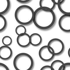 Abstract seamless pattern of randomly arranged black rings with soft shadows on white background