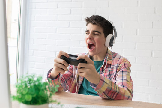 child or young teenager playing with the console
