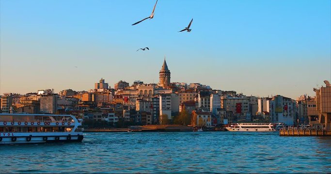 Galata Tower in istanbul City of Turkey.  View of the Istanbul City of Turkey with bosphorus, seagulls and boats.