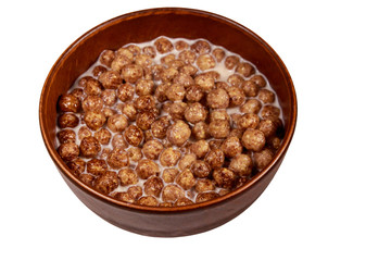 Fototapeta na wymiar Cereal chocolate balls with milk in a bowl isolated on white background