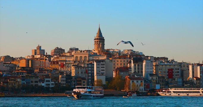 Galata Tower in istanbul City of Turkey.  View of the Istanbul City of Turkey with bosphorus, seagulls and boats.