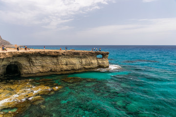 Fototapeta na wymiar CYPRUS, AYIA NAPA - MAY 11/2018: Tourists visited one of the most popular sights - Sea Caves