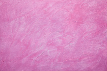 Pink plaster background - uneven rough surface © digieye