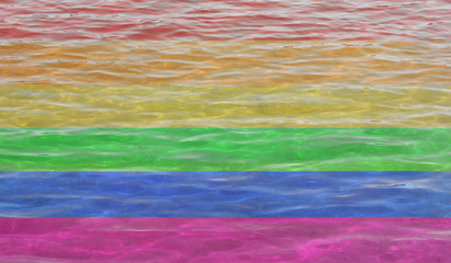 LGBT pride rainbow flag on abstract water background. Gay pride flag - symbol of LGBTQ community 