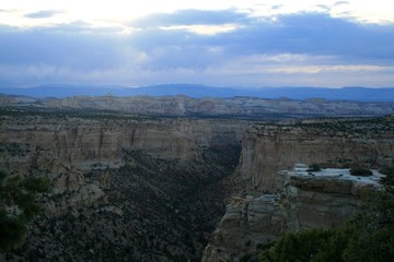 Eagle Canyon in Utah USA, in the evening, after sunset. Gray cliffs of canyon at dusk. The sky is cloudy.