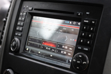 The tape recorder in the car. Music in the car and navigation. Buttons on the radio