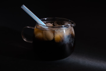 A cool glass of cola drink with ice
