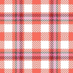 Seamless tartan plaid pattern in red, pink, green and white. Fabric texture background