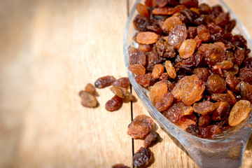 Dry, dried rasins in bowl closeup, healthy sweet food