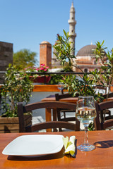 Glass and saucer on the table