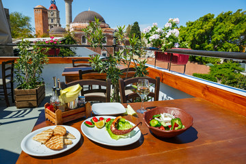 Lunch on the table against  Rhodes