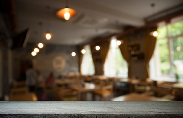 Empty wooden table in front of abstract blurred background of coffee shop . can be used for display or montage your products.Mock up for display of product