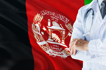 Afghan Doctor standing with stethoscope on Afghanistan flag background. National healthcare system...