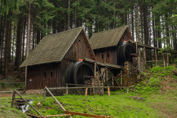 Fototapeta na wymiar Wooden old mill in forest in valley near Zlate Hory town