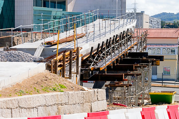 construction site for modern pedestrian footbridge on road highway