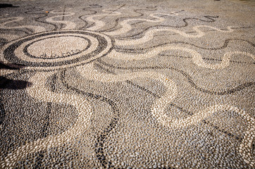 Fototapeta na wymiar Beautiful stone pavement in a shape of sun in Cinque Terre, Italy