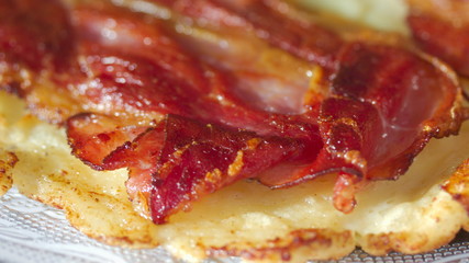 Close up of a pancake with bacon